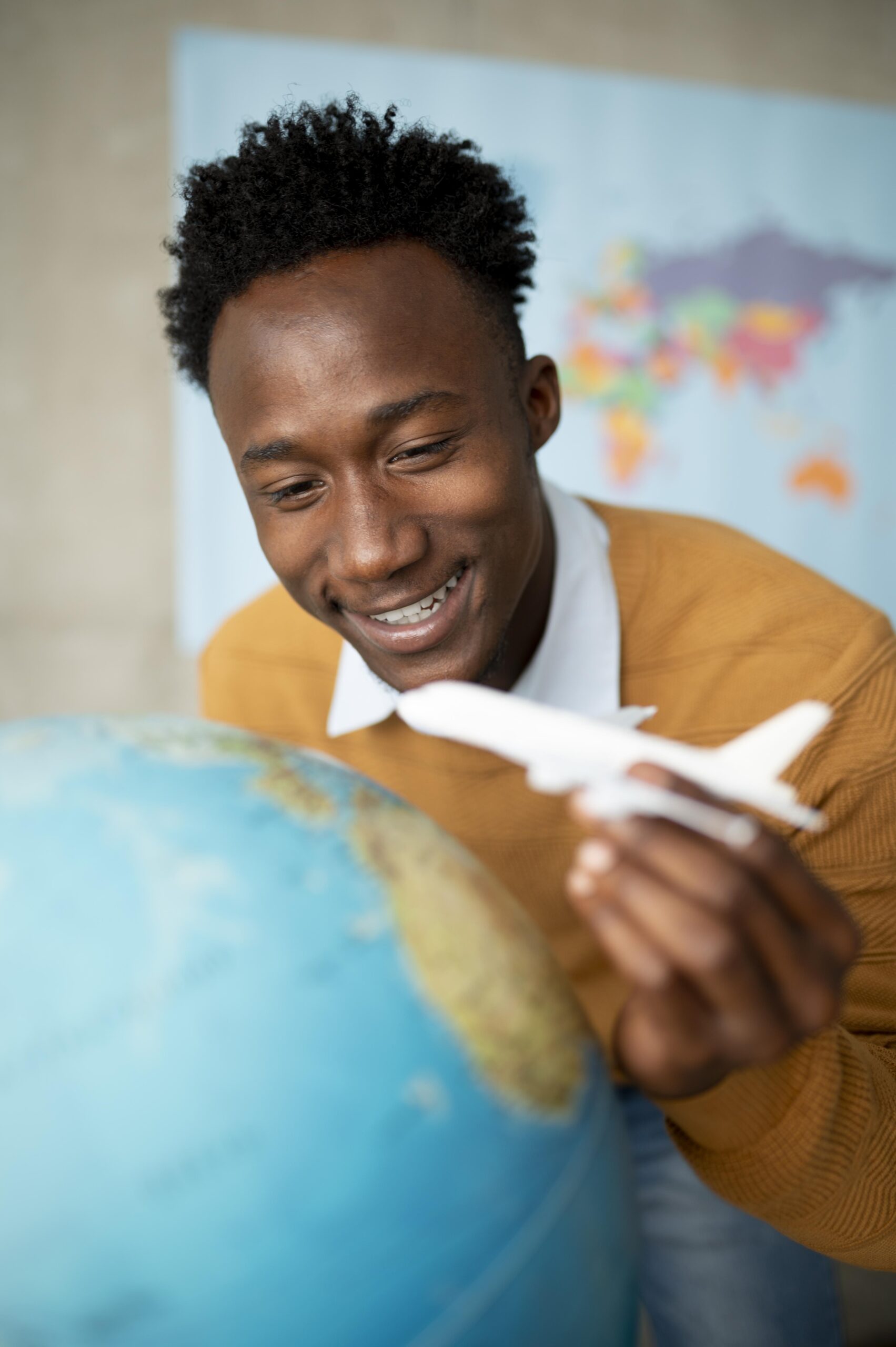 close-up-man-holding-small-plane